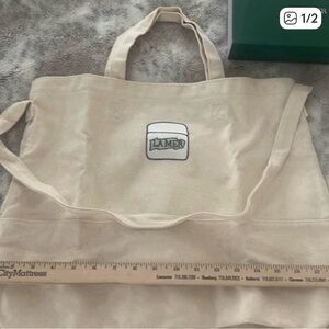 La Mer Tan Canvas Duffel Bag